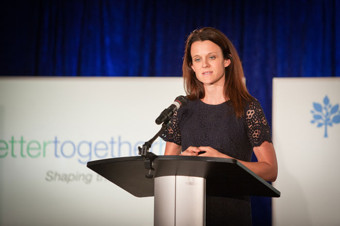 woman speaking at podium