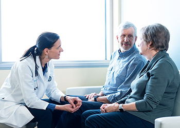 Doctor listening to elderly patients