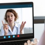 Close up of patient talk on video call with female doctor or nurse with internet wireless communication, person speak consult online with physician using virtual webcam conference on computer